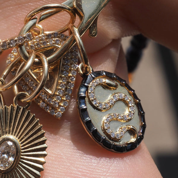 BECCA SNAKE OVAL CHARM